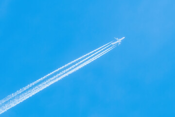 Jet in the blue sky. Diagonal view. Aircraft travel.