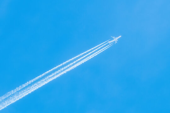 Jet in the blue sky. Diagonal view. Aircraft travel. © Denis Shitikoff