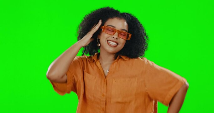 Black woman dance in fashion sunglasses on green screen, fun and freedom with energy on studio background. Funky, retro eyewear and style, carefree female dancer with mockup space and dancing rhythm