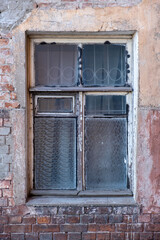 Fototapeta na wymiar Old window in a brick wall