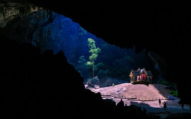 Mystique view to the Phraya Nakhon Cave with the Khuha Kharuehat Pavilion illuminated by Sun through the Hole in the Rocky Top, Thailand