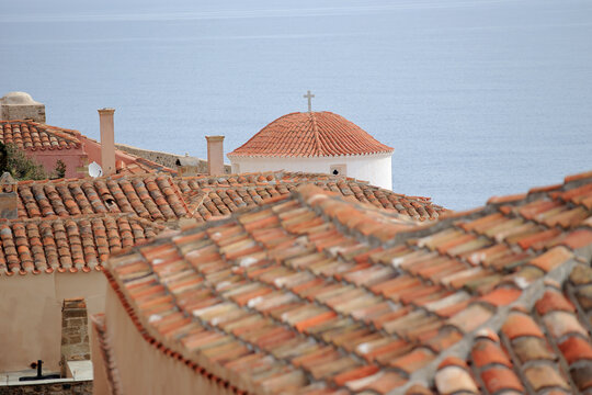 Monemvasia (Peloponnese, Greece) - Roof of Church Panagia Chrisafítissa built by the Venetians in the 17th century and typical Mediterranean roofs of tenement houses.