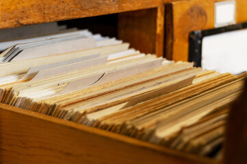 An old pull-out file cabinet with cards. Library, retro, shuffleboard 