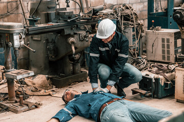 Fototapeta na wymiar The fatal accident was a heart attack to become unconscious and unresponsive suffered by the robotic welding technician. The Cardio Pulmonary Resuscitation performed by the coworker has no benefit. 
