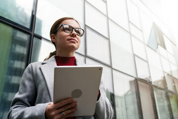 Portrait female entrepreneur with digital tablet in hands.