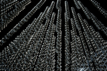 The glowing electric bulb lamps in a row of lamps.
