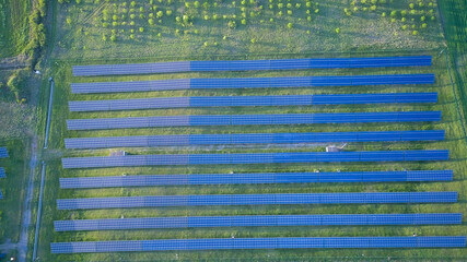 Fields with photovoltaic solar panels for the production of green energy on an industrial scale.