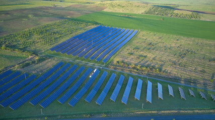 Fields with photovoltaic solar panels for the production of green energy on an industrial scale.