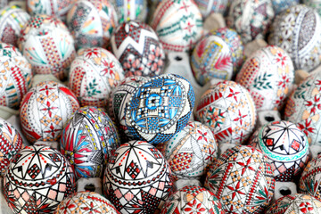 Fototapeta na wymiar Traditional romanian hand painted rustic Easter eggs displayed to be bought by visitors at a Easter market.
