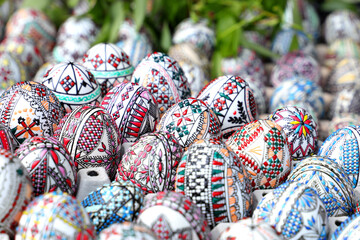 Traditional romanian hand painted rustic Easter eggs displayed to be bought by visitors at a Easter...