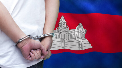 A man getting under arrest in Cambodia. Concept of being handcuffed, detained, incarcerated and...