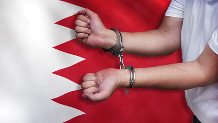A man getting under arrest in Bahrain. Concept of being handcuffed, detained, incarcerated and...