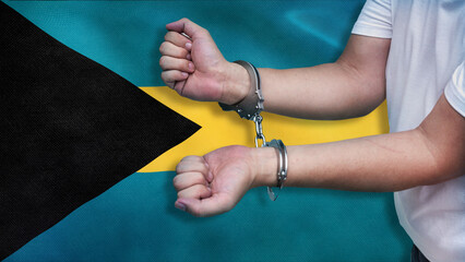 A man getting under arrest in the Bahamas. Concept of being handcuffed, detained, incarcerated and...