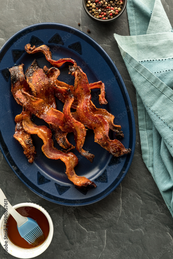 Wall mural top down view of a platter of crispy maple peppercorn bacon.