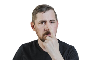 Portrait of an attractive bearded man of European appearance, with a slight gray hair, on an isolated white background. He put his finger to his nose. Expression of emotions of a man.