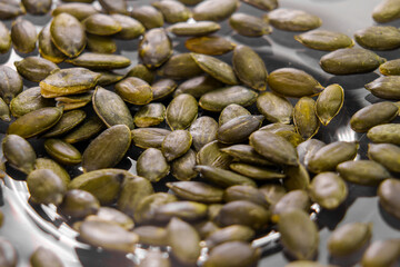Green organic pumpkin seeds close up
