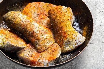 Raw files from Basa, with spices in a supply