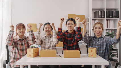 Team of smes warehouse checking email and writing on parcel cardboard box, Small business entrepreneur, SME, freelance online sellers, influencer and the team behind the work.
