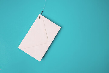 White envelope on the fish hook. Phishing email concept,