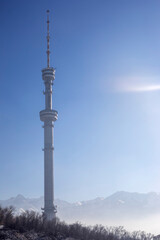 Fototapeta premium Tall tower with antennae for transmissions on a hill Kok Tobe Kazakhstan