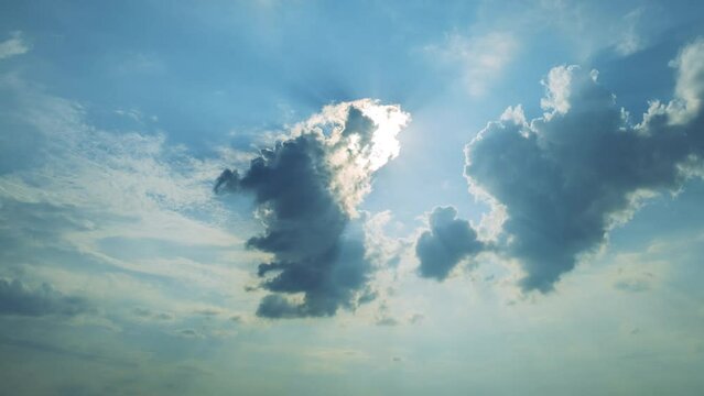 Fast moving clouds with the wind in the sky and sun. Time lapse. 4k footage UHD 3840x2160 