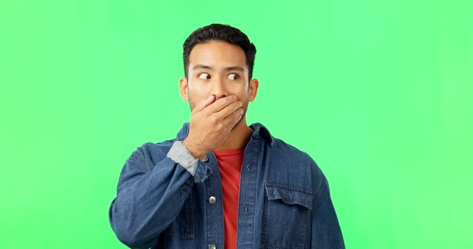 Face, shock and surprise of man on green screen in studio isolated on a background mockup. Portrait, wow and person with hands over mouth after gossip, drama and omg, rumor or wtf, emoji or reaction