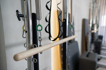 Close-up of a detail of a reformer machine. Pilates studio without people. 