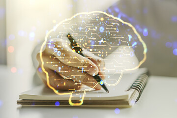 Creative artificial Intelligence concept with human brain sketch and man hand writing in diary on background. Double exposure