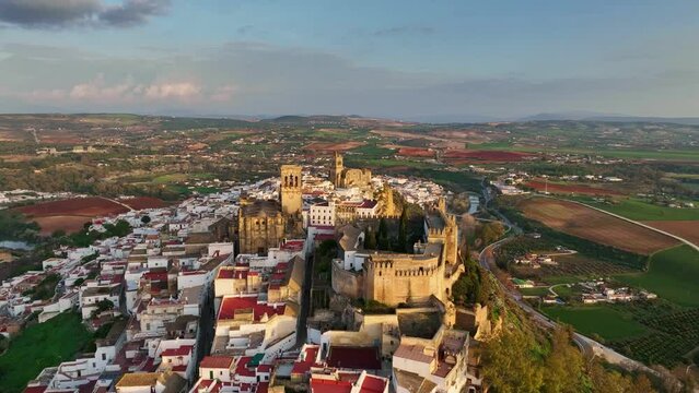 Aerial shot one of famous pueblos blancos in Andalusia - Arcos de la Frontera. Flying around Arcos de la Frontera, Andalucia, Spain at sunset