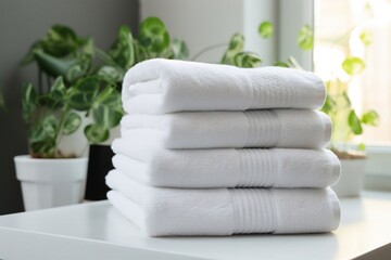Fototapeta na wymiar White clean towels stack on table in bathroom, generative ai image