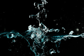 Obraz na płótnie Canvas Water surface with bubbles on black background.