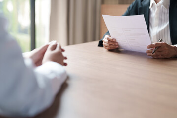 Successful job interview, Recruiter or manager and job candidate with resume in office..