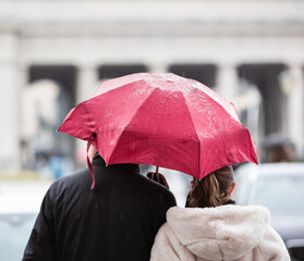 persons with umbrella in rain