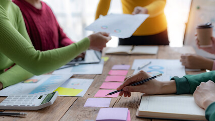 Teamwork. Group of business people brainstorming meeting together with economic report document....