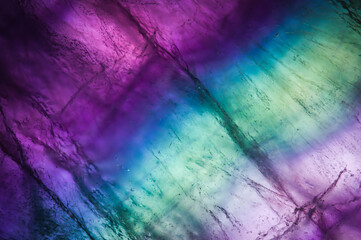 Fluorite layered slice. macro detail texture background. close-up polished semi-precious gemstone.