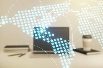 Abstract creative world map with connections on modern laptop background, international trading concept. Multiexposure