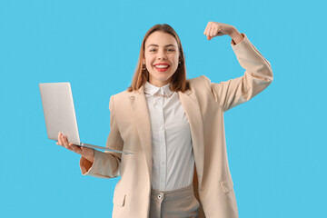 Female programmer with laptop showing muscles on blue background