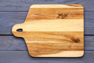 New kitchen board on color wooden background