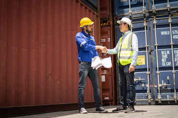 Engineer manager and foreman shaking hands together, foreman Join Hand for Collaboration in the container yard.