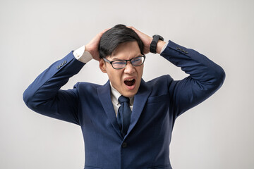 Portrait of stress Asian businessman in glasses holding head with hands, business problem isolated on white background