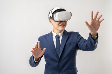 Portrait of confident Asian businessman using VR virtual reality headset isolated on white background