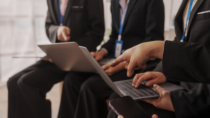 Group of four asian business people only women bookkeepers brainstorm in a meeting plan development, audit, balance sheet, manager and an employee communicating with full team.