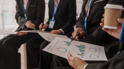 Group of four asian business people only women bookkeepers brainstorm in a meeting plan development, audit, balance sheet, manager and an employee communicating with full team.