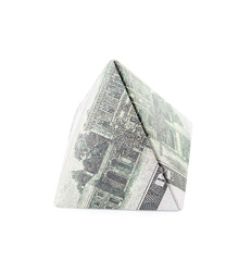 Origami pyramid made of dollar banknotes on white background