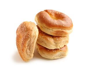 Tasty bagels with sesame seeds on white background