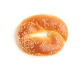 Half of tasty bagel with sesame seeds on white background