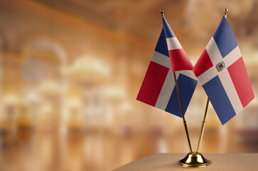 Small flags of the Dominicana on an abstract blurry background
