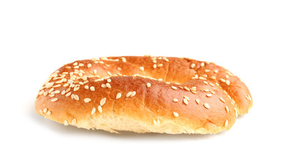 Half of tasty bagel with sesame seeds on white background
