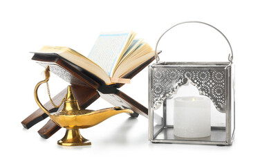 Muslim lantern with Aladdin lamp and Koran on white background