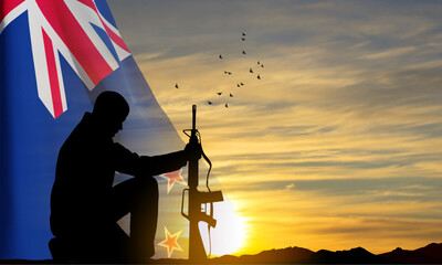 Silhouettes of a soldier kneeling down with New Zealand flag against the sunset. Background fo memorial day. EPS10 vector